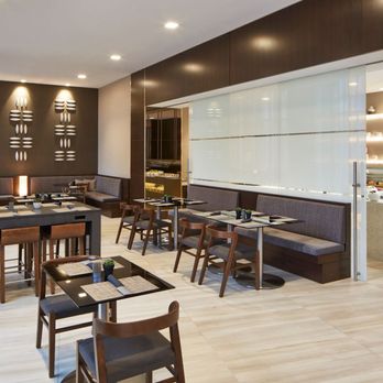 AC Lounge - a dining area with tables and chairs - Cocktail Bars Near Me - Minneapolis, Minnesota