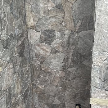 Baam Home Services - Toilet area surrounded by grey porcelain walls. - Drywall Installation & Repair Near Me - Las Vegas, Nevada
