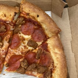 Pizza Hut - There are multiple pieces of hair on this pizza