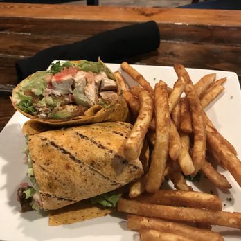 Brick and Porter - Fried avocado and chicken wrap. Wrap was a little heavy in dressing/mayo for my taste. The fries were perfect! - Pubs Near Me - Grand Rapids, Michigan