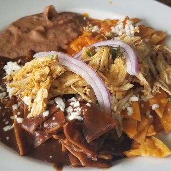 Sabor Cocinabar - Chilequiles divorciados with the chipotle sauce and mole sauce. - Mexican Near Me - San Antonio, Texas Sabor Cocinabar - Chilequiles divorciados with the chipotle sauce and mole sauce. - Mexican Near Me - San Antonio, Texas
