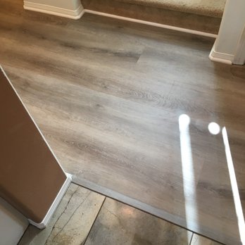 My Flooring Guy - Hallway that meets with carpeted stairs and tiled kitchen - Flooring Near Me - Orange, California