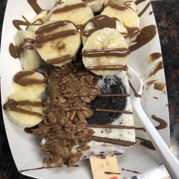 The Paleta Bar - Cookies and cream Paleta, half dipped in milk chocolate and dipped in cocoa pebbles with bananas and a milk chocolate drizzle. - Ice Cream & Frozen Yogurt Near Me - Albuquerque, New Mexico