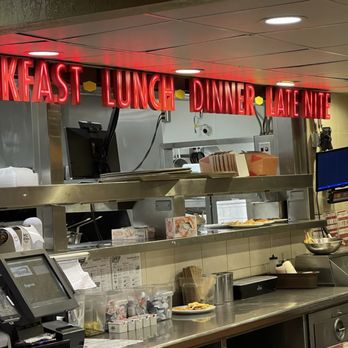 Denny's - a restaurant kitchen with a neon sign - American Near Me - San Antonio, Texas
