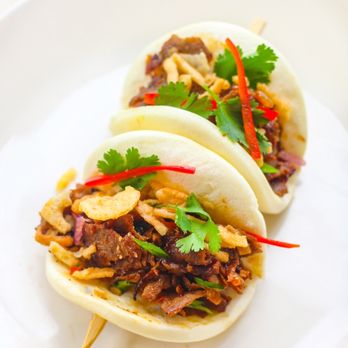 Tumbao Buns - Downtown Miami - two buns on a plate - Latin American Near Me - Miami, Florida Tumbao Buns - Downtown Miami - two buns on a plate - Latin American Near Me - Miami, Florida