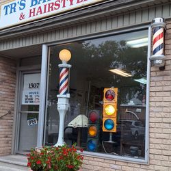 T R's Barber Shop - Here is the traditional barber shop with traditional hours and that striped contraption in "See-cwah-kus" (for non-Northeasterners)