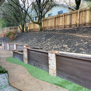 Precise Landscaping - a sloped backyard with a retaining wall - Tree Services Near Me - Auburn, California Precise Landscaping - a sloped backyard with a retaining wall - Tree Services Near Me - Auburn, California