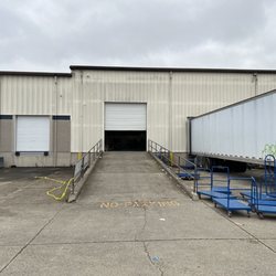 BidFTA - You enter the warehouse from the back (there are signs that say BidFTA handing on those handrails)