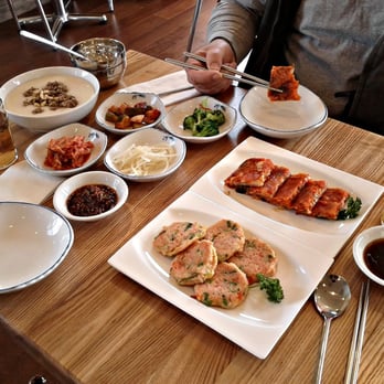 Spoon - l-r (sort of): porridge with pine nuts and ground beef, four banchan, sesame dipping sauce, kimchi pancakes, crab cakes. - Korean Near Me - Berkeley, California Spoon - l-r (sort of): porridge with pine nuts and ground beef, four banchan, sesame dipping sauce, kimchi pancakes, crab cakes. - Korean Near Me - Berkeley, California