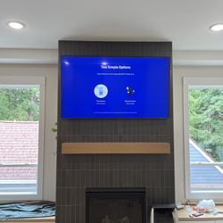 West PDX Handyman - 65inch tv mounted on tiled fireplace