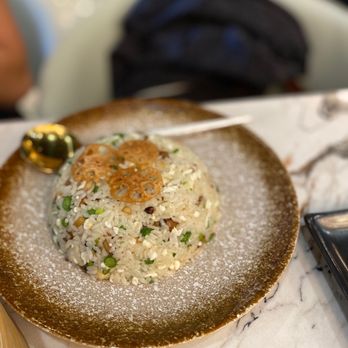Supreme Dumplings - Mushroom fried rice is delicious. Fried lotus on top. - Shanghainese Near Me - Bellevue, Washington Supreme Dumplings - Mushroom fried rice is delicious. Fried lotus on top. - Shanghainese Near Me - Bellevue, Washington
