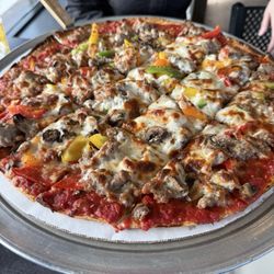 Thin crust 16 inch pizza with sausage, green, yellow, and red peppers, mushroom, and sausage
