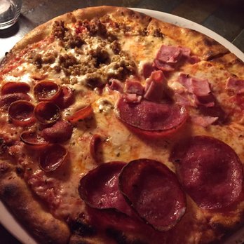 La Vita E Bella - Quattro Carne pizza... divided into four: sausage, salami, pepperoni, and ham - Italian Near Me - Seattle, Washington La Vita E Bella - Quattro Carne pizza... divided into four: sausage, salami, pepperoni, and ham - Italian Near Me - Seattle, Washington