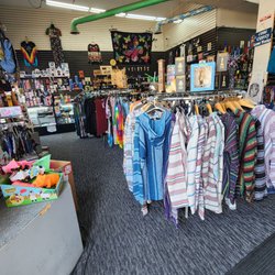 Waterbeds 'n' Stuff - Left aisle inside with bajas, shirts, and products