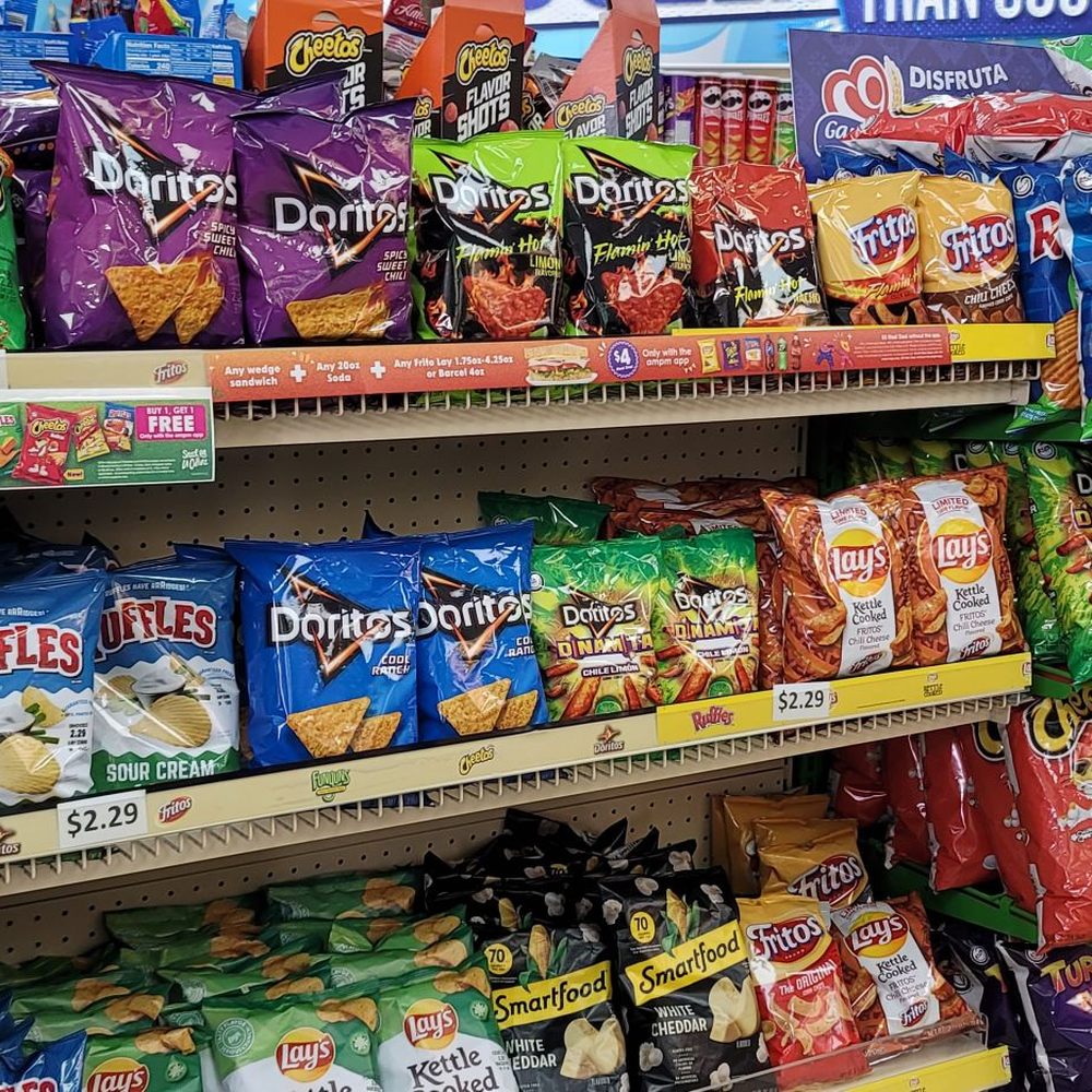 ampm - a shelf of chips and snacks - Convenience Stores Near Me - Palm Desert, California