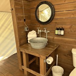 Conestoga Ranch Glamping Resort - Super clean charming bathroom in our tent