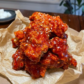 Jeju Restaurant - a pile of chicken wings on a piece of wax paper - Korean Near Me - Tofino, British Columbia Jeju Restaurant - a pile of chicken wings on a piece of wax paper - Korean Near Me - Tofino, British Columbia