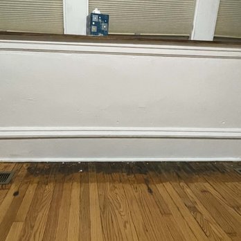 Preferred Comfort Heating & Cooling - after - we painted the baseboard to cover up the damage. we will eventually refinish the floor so that it matches the rest of the room - Heating & Air Conditioning/HVAC Near Me - Chicago, Illinois