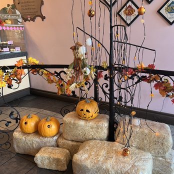 Nadia Cakes TEST - a display of pumpkins and hay bales - Bakeries Near Me - Palmdale, California