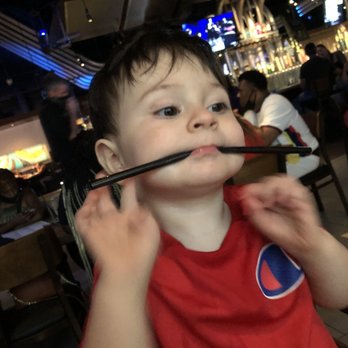 Yard House - My son amusing himself - New American Near Me - Orlando, Florida Yard House - My son amusing himself - New American Near Me - Orlando, Florida