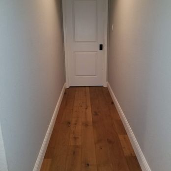 Ljs Flooring - Engineered hardwoods and baseboards installed throughout the house (baseboards not yet painted) - Flooring Near Me - Lewisville, Texas