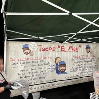 Tacos El May - a woman standing under a tent - Street Vendors Near Me - Westminster, California