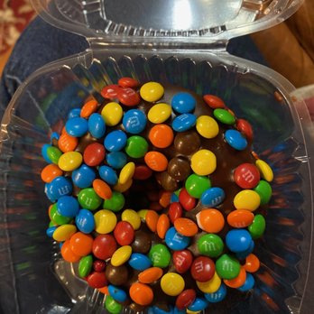 Doughology - Lynbrook - Chocolate donut with glaze covered in mini M&Ms - Donuts Near Me - Lynbrook, New York Doughology - Lynbrook - Chocolate donut with glaze covered in mini M&Ms - Donuts Near Me - Lynbrook, New York