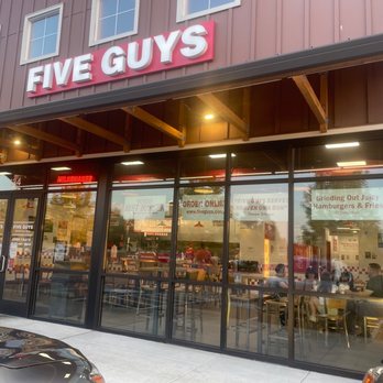 Five Guys - the front of a five guys restaurant - Burgers Near Me - Happy Valley, Oregon