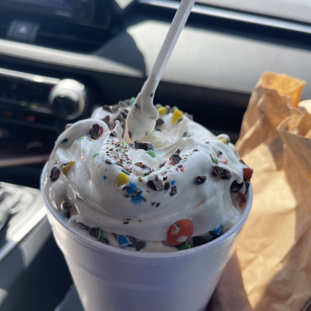 Frosty King - a hand holding a cup of ice cream - New American Near Me - Delano, California
