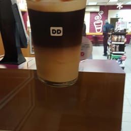 a cup of coffee on a table a cup of coffee on a table