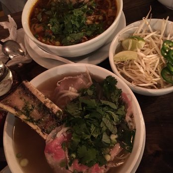 Ginger and Lemongrass - Spicy lemongrass soup with bone marrow (top), beef pho soup with marrow (bottom) - Vietnamese Near Me - Whitestone, New York
