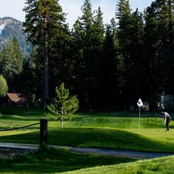Bear Mountain Golf Course - Two golfers putting on a green at Bear Mountain Golf Course.