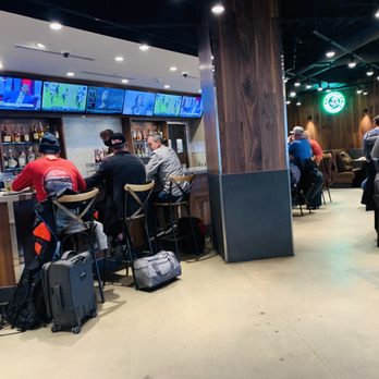 Shake Shack - a group of people sitting at a bar - Burgers Near Me - Denver, Colorado Shake Shack - a group of people sitting at a bar - Burgers Near Me - Denver, Colorado