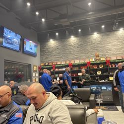 Village Cigar Headquarters - Smoking area and counter