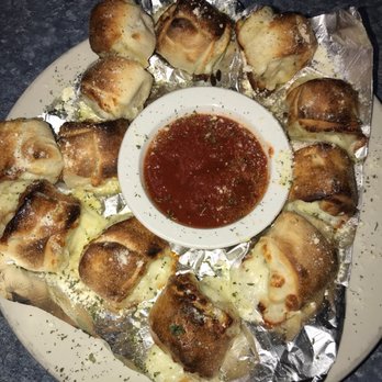 Giovanni's - a plate of bread rolls with a dipping sauce - Italian Near Me - Piney Flats, Tennessee Giovanni's - a plate of bread rolls with a dipping sauce - Italian Near Me - Piney Flats, Tennessee