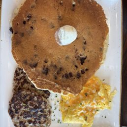 Trifecta with chocolate chip pancake, chicken sausage patties, and scrambled eggs with cheese