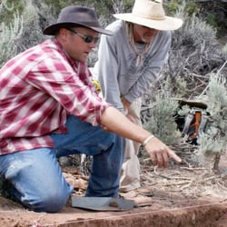 Crow Canyon Archaeological Center - Crow Canyon archaeologists examine an excavation site.