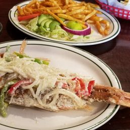 Whole red snapper fried in a garlic sauce, with the sides that come with it. Whole red snapper fried in a garlic sauce, with the sides that come with it.