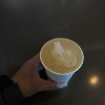 Logan House Coffee Company - Aurora - hand holding a cup of coffee - Coffee & Tea Near Me - Aurora, Colorado Logan House Coffee Company - Aurora - hand holding a cup of coffee - Coffee & Tea Near Me - Aurora, Colorado