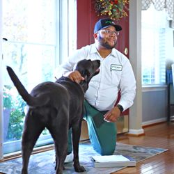 Green Pest Solutions - Pest Control Technician servicing a home