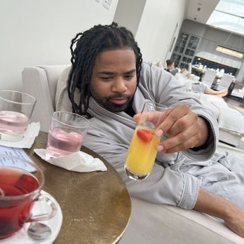 Rivage Day Spa - Patron enjoying a complimentary mimosa - Day Spas Near Me - Birmingham, Michigan