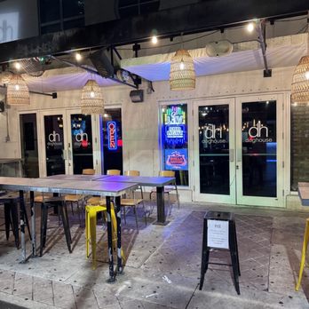 Doghouse - the outside of a restaurant with tables and chairs - Hot Dogs Near Me - Miami, Florida Doghouse - the outside of a restaurant with tables and chairs - Hot Dogs Near Me - Miami, Florida