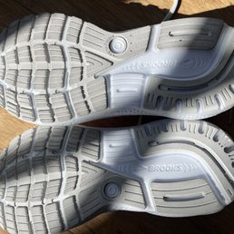 Dirty white soles with a rock. Dirty white soles with a rock.