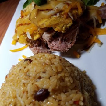 Platos - El Jabirito (stuffed plantains with pulled pork topped with mozzarella and cheddar, seasoned rice) - Latin American Near Me - Carolina, Puerto Rico Platos - El Jabirito (stuffed plantains with pulled pork topped with mozzarella and cheddar, seasoned rice) - Latin American Near Me - Carolina, Puerto Rico