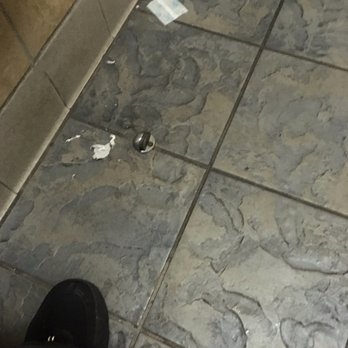 Ono Hawaiian BBQ - Bathrooms are designed for easy maintenance but not even swept. - Hawaiian Near Me - Colma, California