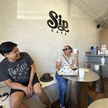 Sip Cafe - Inside of cafe. They have some tables and bench seating. - Coffee & Tea Near Me - Honolulu, Hawaii Sip Cafe - Inside of cafe. They have some tables and bench seating. - Coffee & Tea Near Me - Honolulu, Hawaii