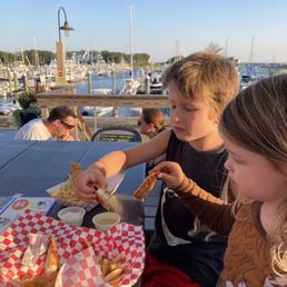 Tables on deck overlooking marina