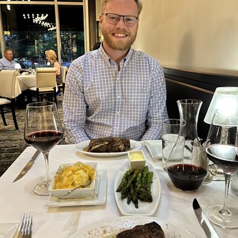 Ruth's Chris Steak House - Petite Filet, Bone-In New York Strip. Grilled Asparagus, Potatoes au Gratin - Steakhouses Near Me - Charlotte, North Carolina Ruth's Chris Steak House - Petite Filet, Bone-In New York Strip. Grilled Asparagus, Potatoes au Gratin - Steakhouses Near Me - Charlotte, North Carolina