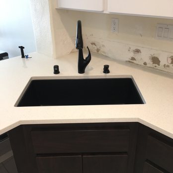 Construction 1 services - a kitchen counter with a sink and faucet - Plumbing Near Me - Los Angeles, California Construction 1 services - a kitchen counter with a sink and faucet - Plumbing Near Me - Los Angeles, California