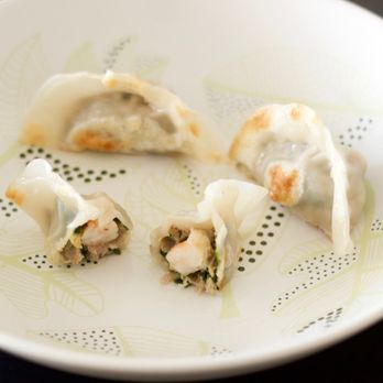 Ayi Dumplings - a plate of dumplings on a table - Food Delivery Services Near Me Ayi Dumplings - a plate of dumplings on a table - Food Delivery Services Near Me